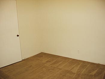 Bedroom with carpet - unrenovated